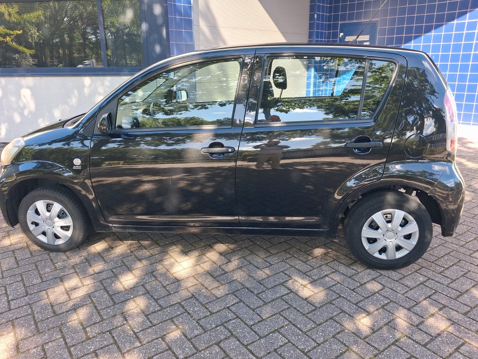 Daihatsu Sirion 1.0 51KW 2008 Zwart, Auto's, Daihatsu, Voorwielaandrijving, Stof, Zwart, Handgeschakeld
