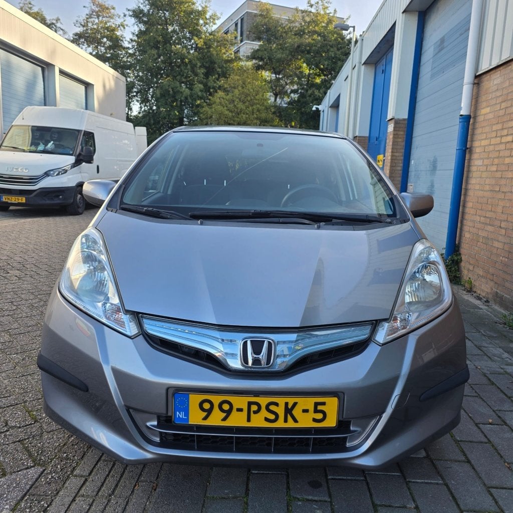Honda Jazz 1.4  HYBRID 2011AUTOMAAT 125800 KM NAP 2e EIGENAA, Auto's, Stof, Zwart, 4 cilinders, Bluetooth
