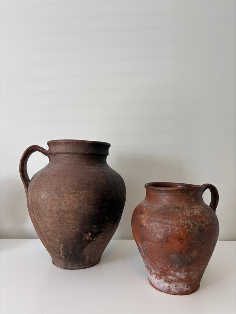 Terracotta olijfkruiken, Ophalen