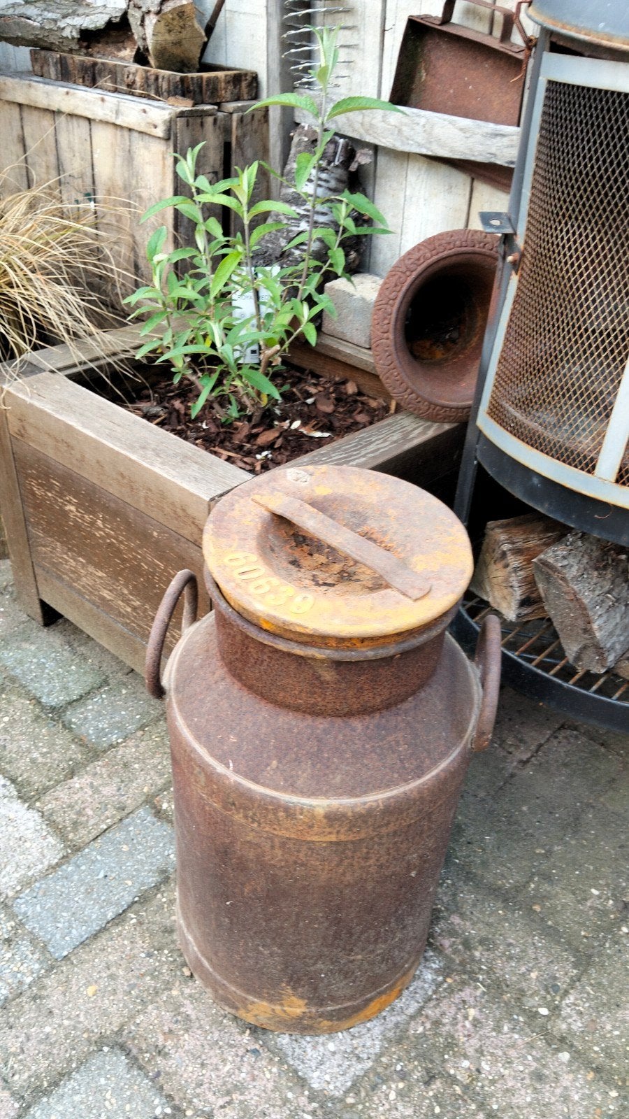 Brocante metalen oude melkbus, Ophalen