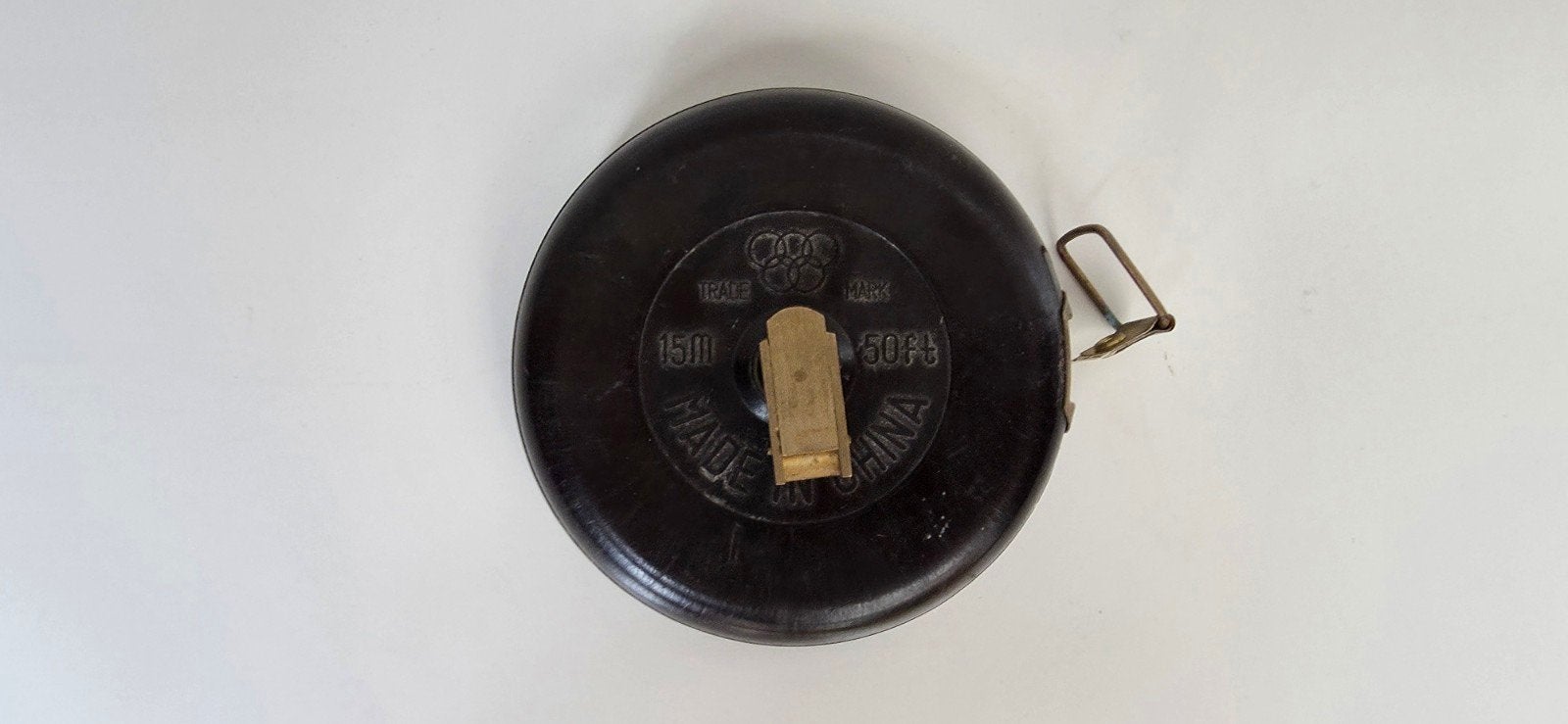 Vintage, oprolbaar meetlint in bakelieten behuizing, Antiek en Kunst, Ophalen of Verzenden