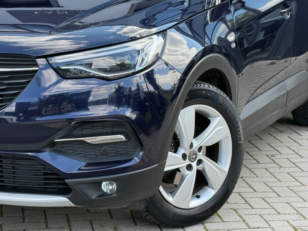 Opel Grandland X 1.2 Turbo 120 Jaar Edition / AUTOMAAT / CAM, Auto's, Gebruikt, Euro 6, 1199 cc, Blauw