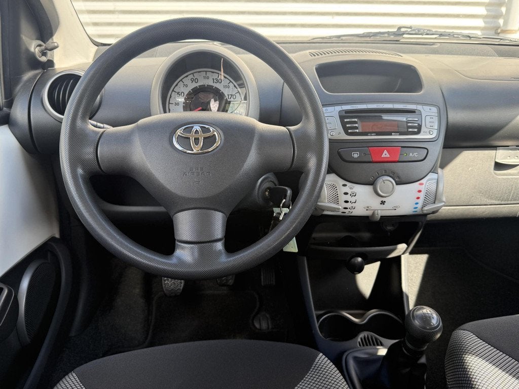 Toyota Aygo 1.0 VVT-i Comfort 2e Eigenaar|Airco|Bluetooth|El, Voorwielaandrijving, Euro 5, Stof, Gebruikt