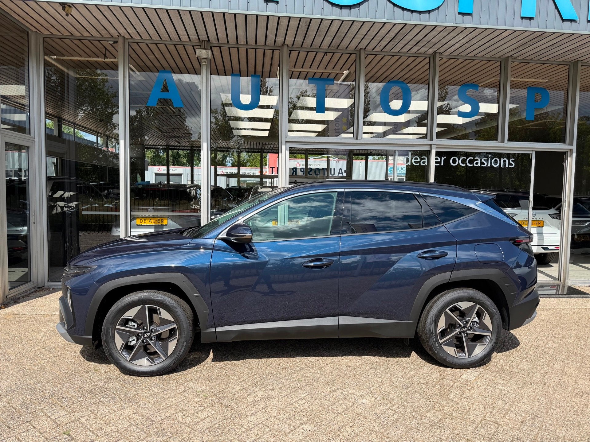 Hyundai Tucson 1.6 T-GDI MHEV Comfort 161PK , NAVIGATIE , CA, Auto's, Stof, Gebruikt, Zwart, 4 cilinders