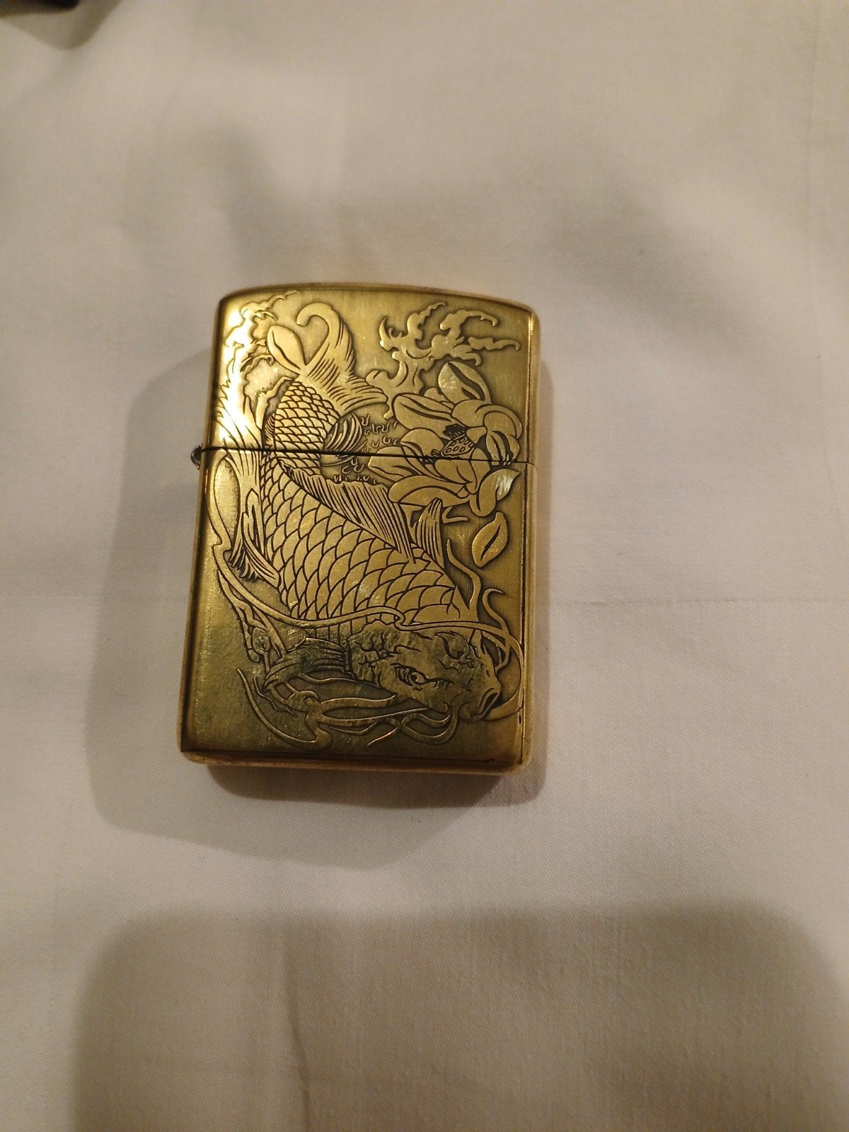 Zippo aansteker zo goed als nieuw met draak en lotus, Ophalen of Verzenden, Zo goed als nieuw, Aansteker