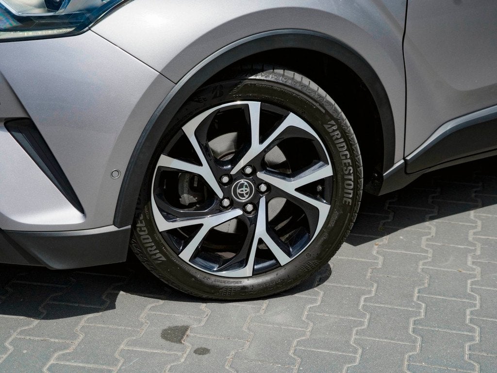 Toyota C-HR 1.8 Hybrid Bi-Tone | TREKHAAK | CAMERA |, Auto's, Toyota, 135 pk, Euro 6, 4 cilinders, Leder en Stof