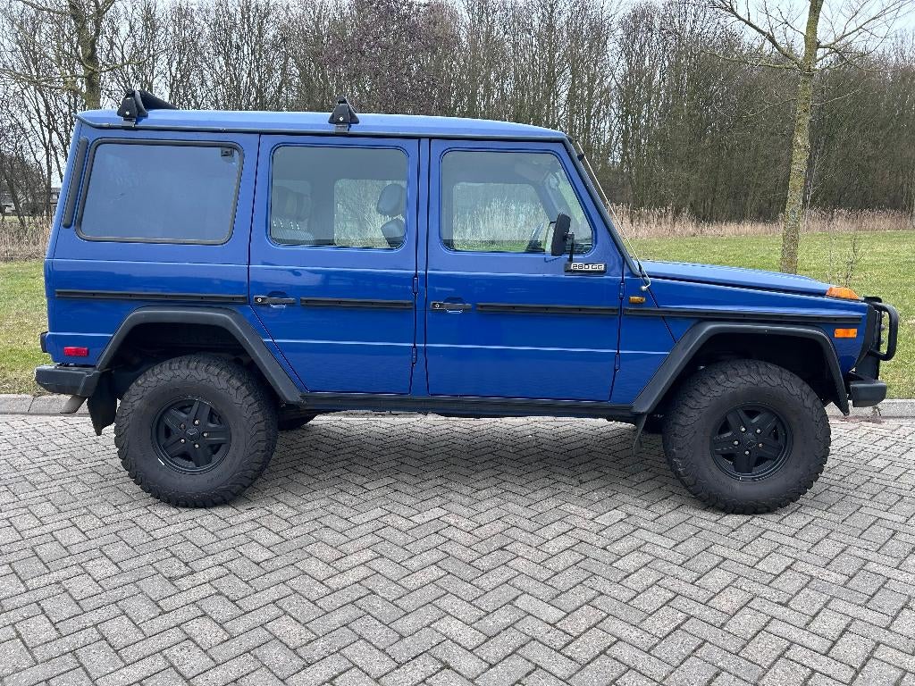 Mercedes G-klasse W460 280GE lang 4X4 1985 oldtimer benzine, Auto's, Mercedes-Benz, Automaat, Zwart, Blauw, Leder