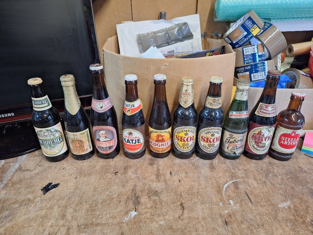 10 oude ongeopende bierflessen Skol Tuborg Stella jaren 80, Verzamelen, Biermerken, Ophalen of Verzenden, Zo goed als nieuw, Overige merken
