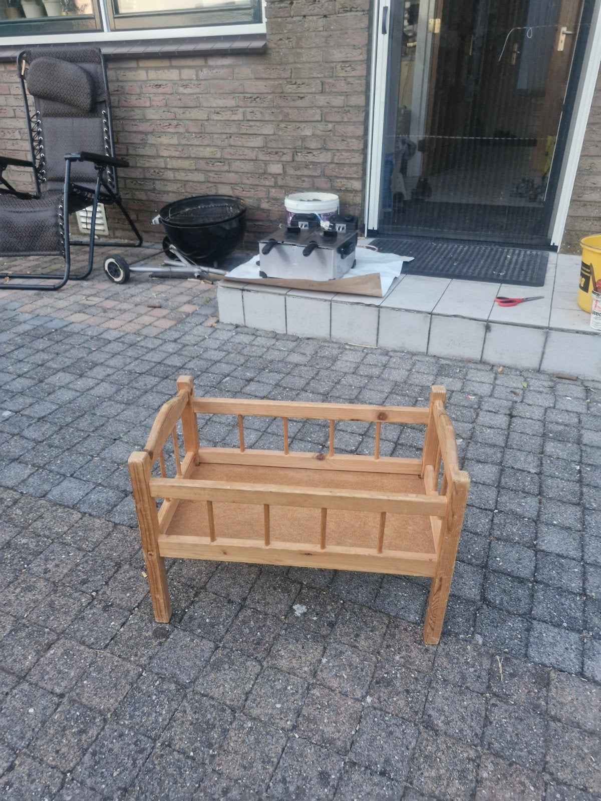 Houten poppenbedje, Ophalen, Babypop
