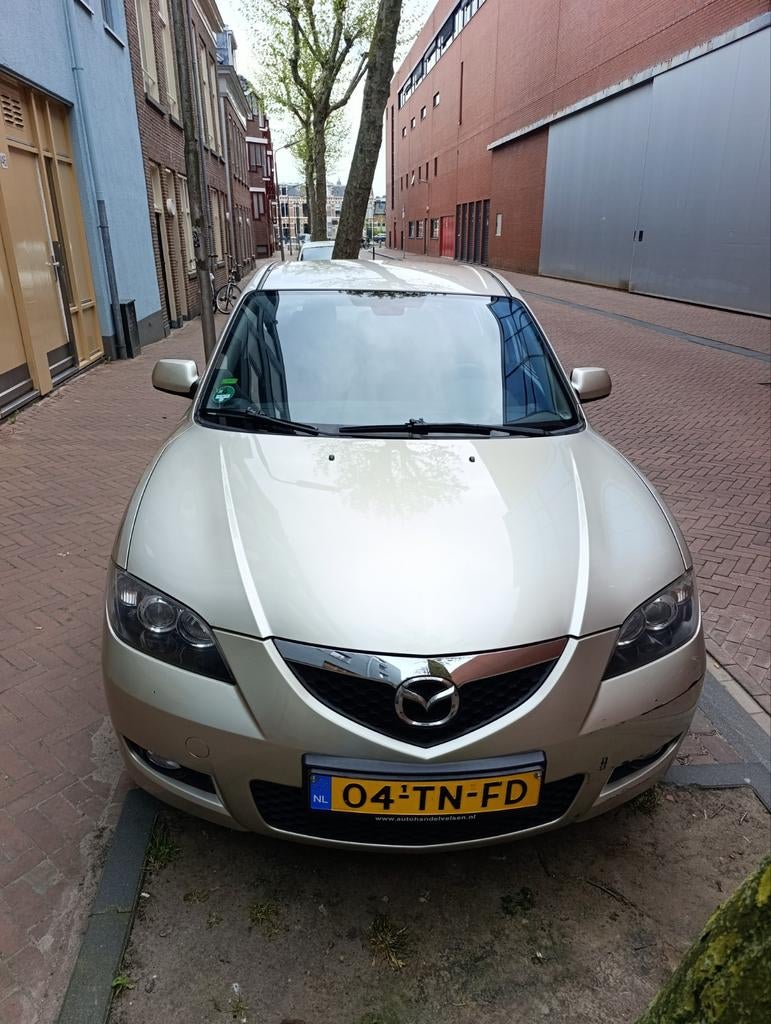 Mazda 3 1.6 Sedan 2006 Grijs, lage km, originele Nederlandse, Auto's, Mazda, Voorwielaandrijving, 4 cilinders, 49 €/maand, 1200 kg