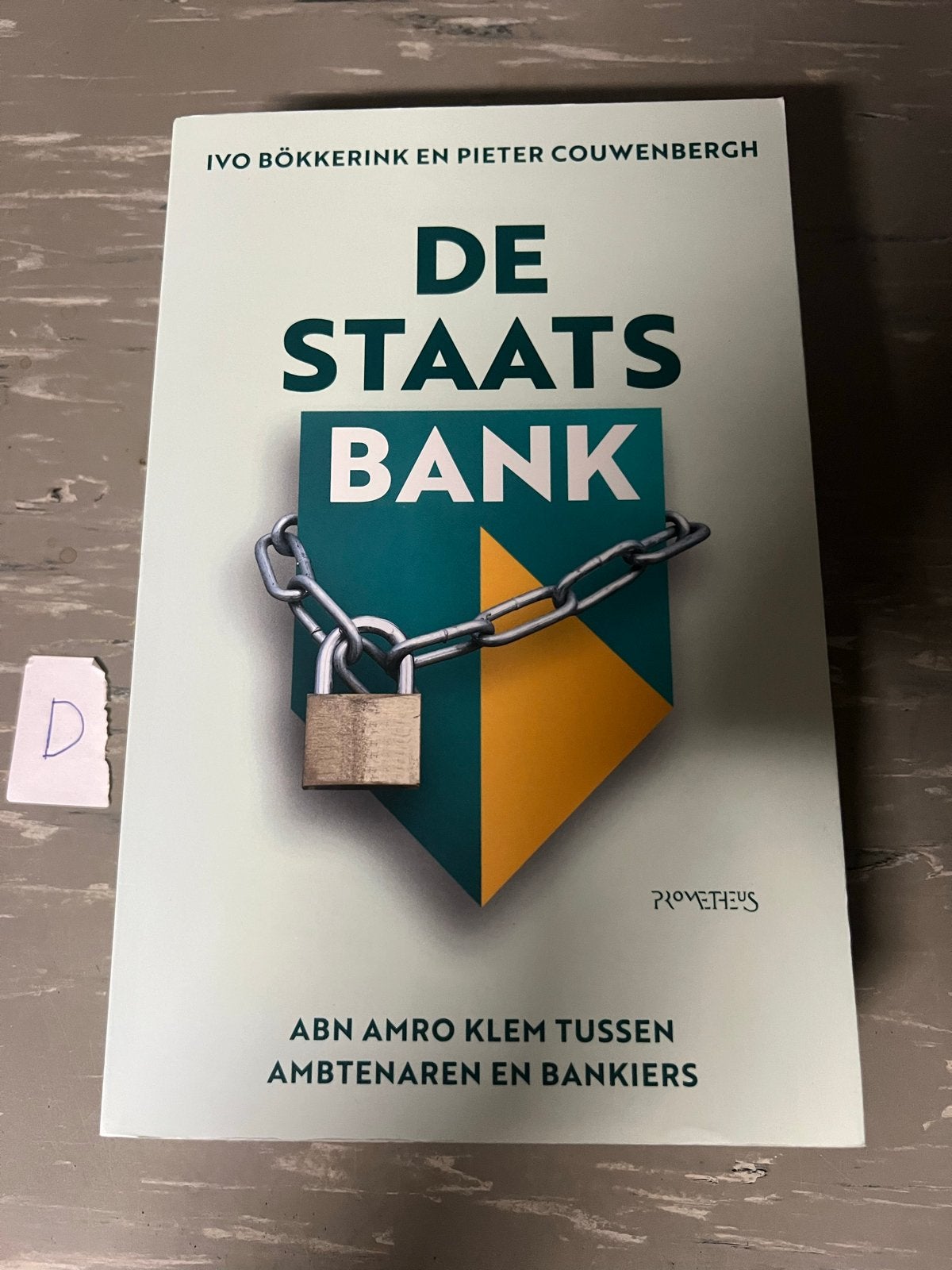De Staatsbank: ABN Amro klem tussen ambtenaren en bankiers, Ophalen of Verzenden, Zo goed als nieuw, Geld en Beleggen