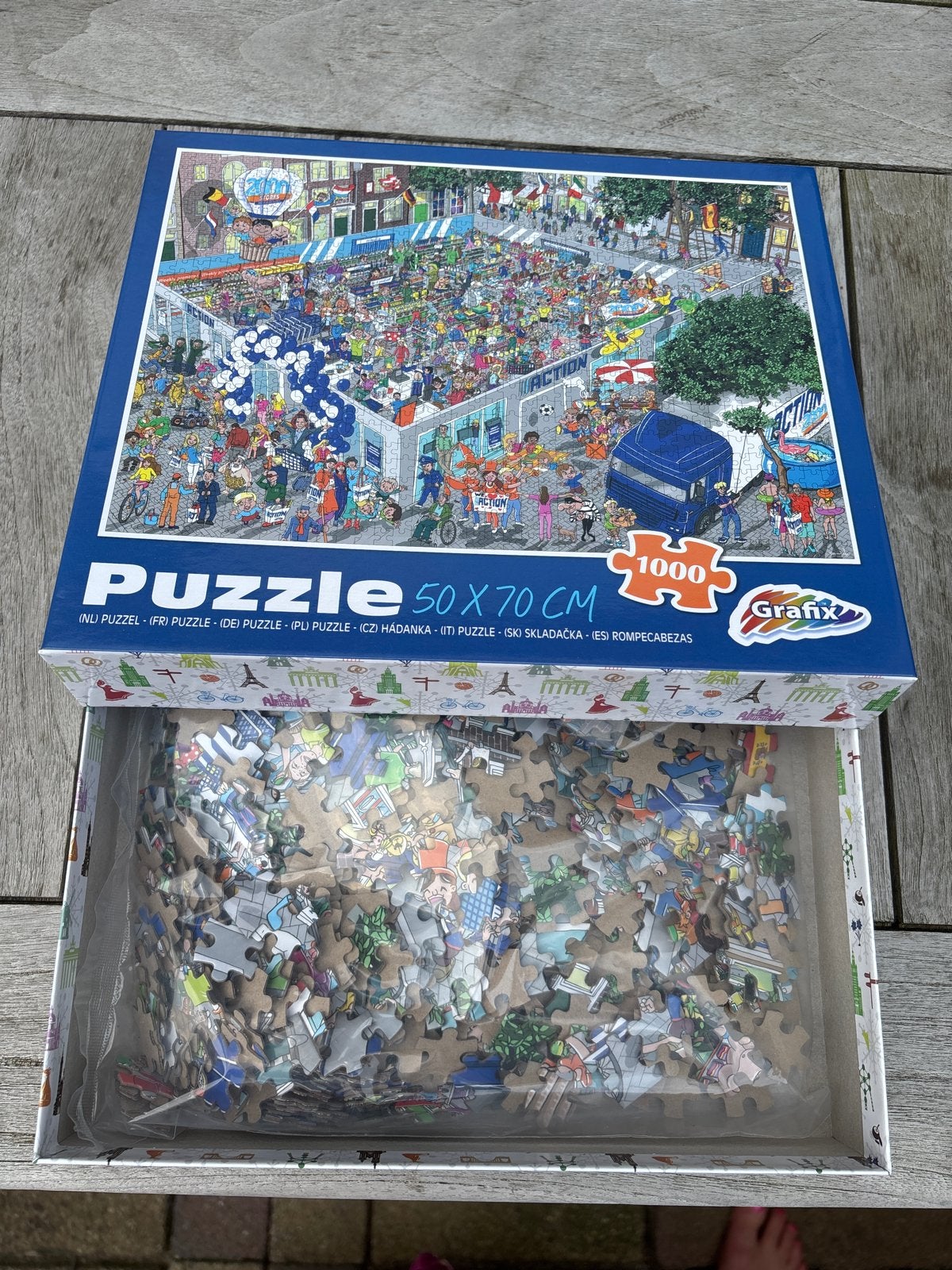 NIEUW Grafix Puzzel 1000 st. Speciale editie ACTION, Hobby en Vrije tijd, Denksport en Puzzels, Gebruikt, Legpuzzel, 500 t/m 1500 stukjes