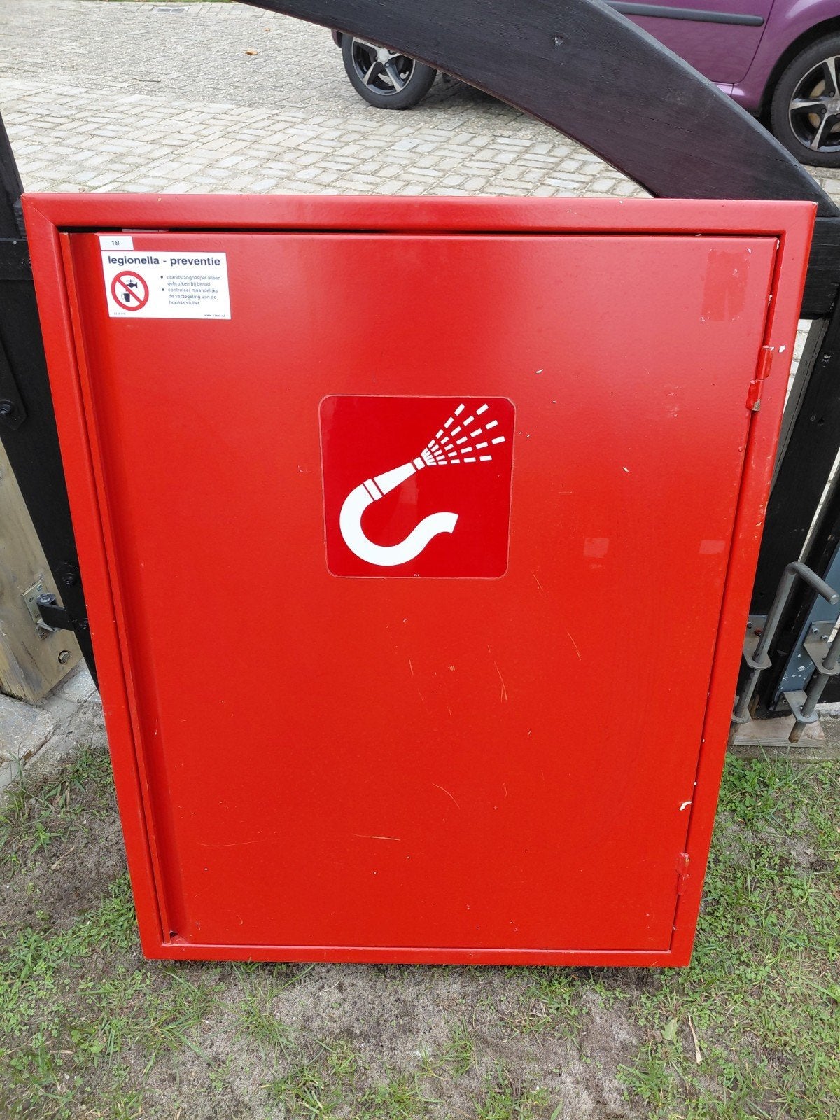 brandslanghaspel met kast, Ophalen