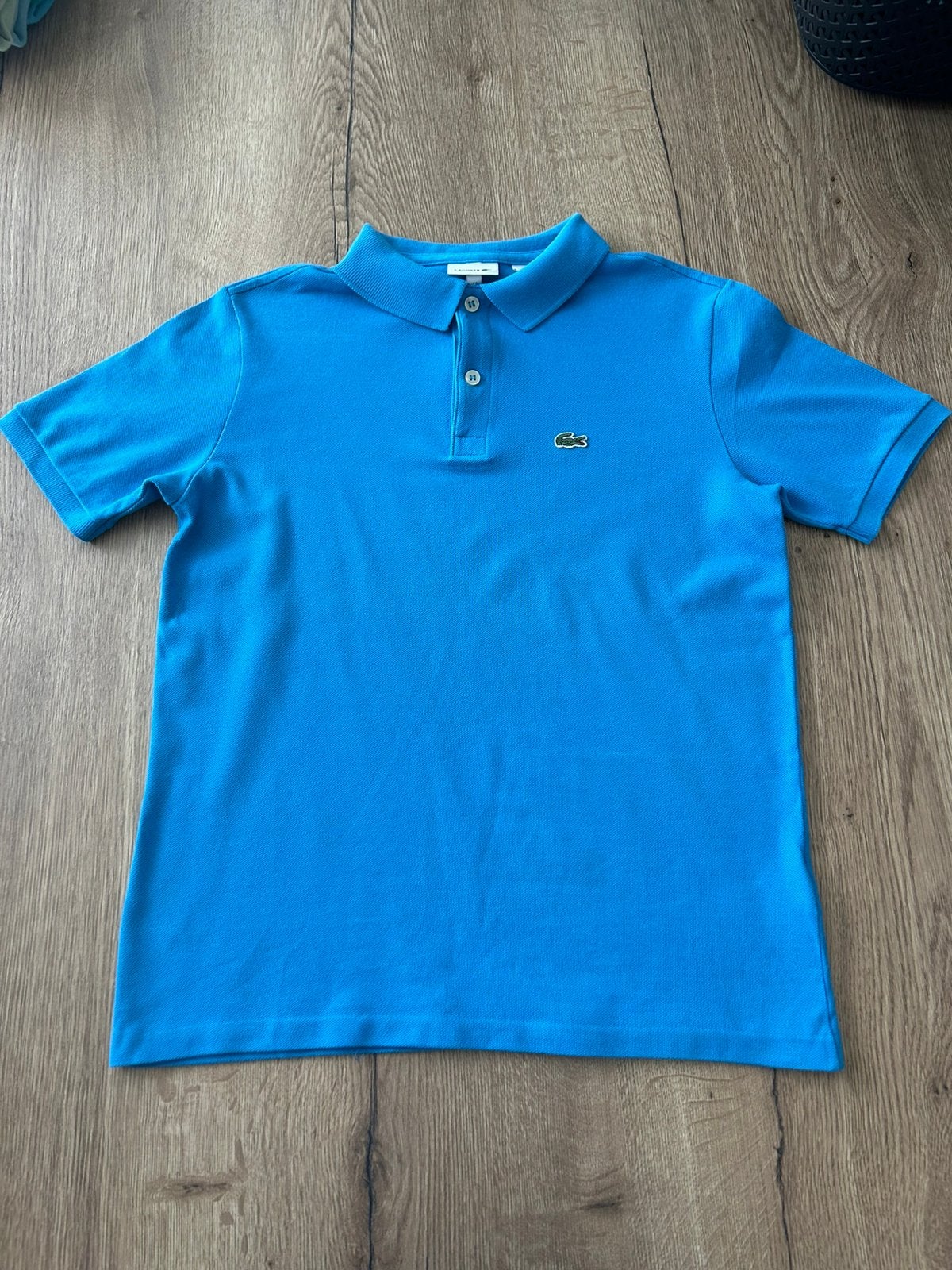 Polo Lacoste, blauw maat 170-176, Ophalen of Verzenden, Zo goed als nieuw, Jongen, Shirt of Longsleeve