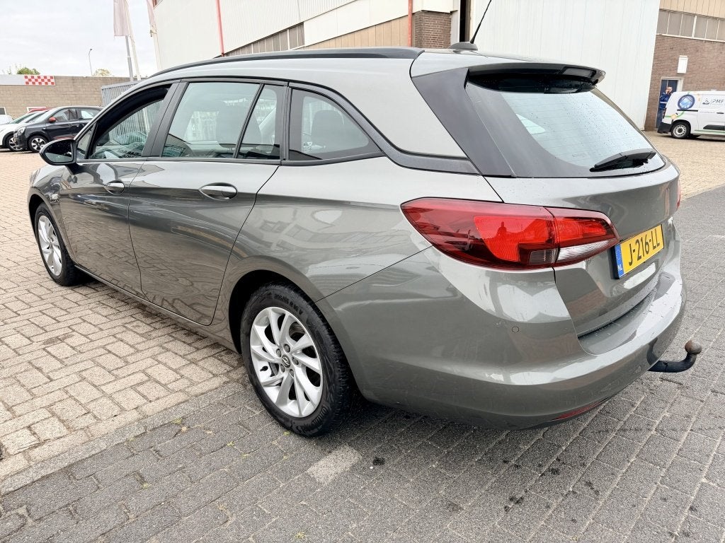 Opel Astra Sports Tourer 1.4 Business Edition (bj 2020), Auto's, Opel, Automaat, Stof, Gebruikt, 146 pk