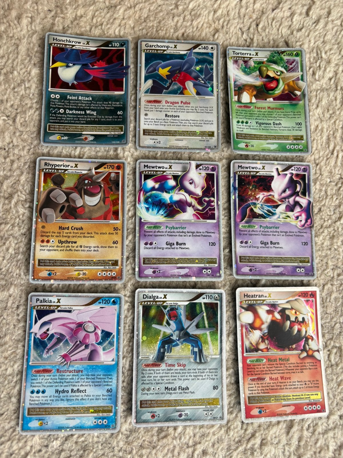 9 pokemon kaarten lv X mewtwo, garchomp palkia, Ophalen of Verzenden, Zo goed als nieuw, Meerdere kaarten