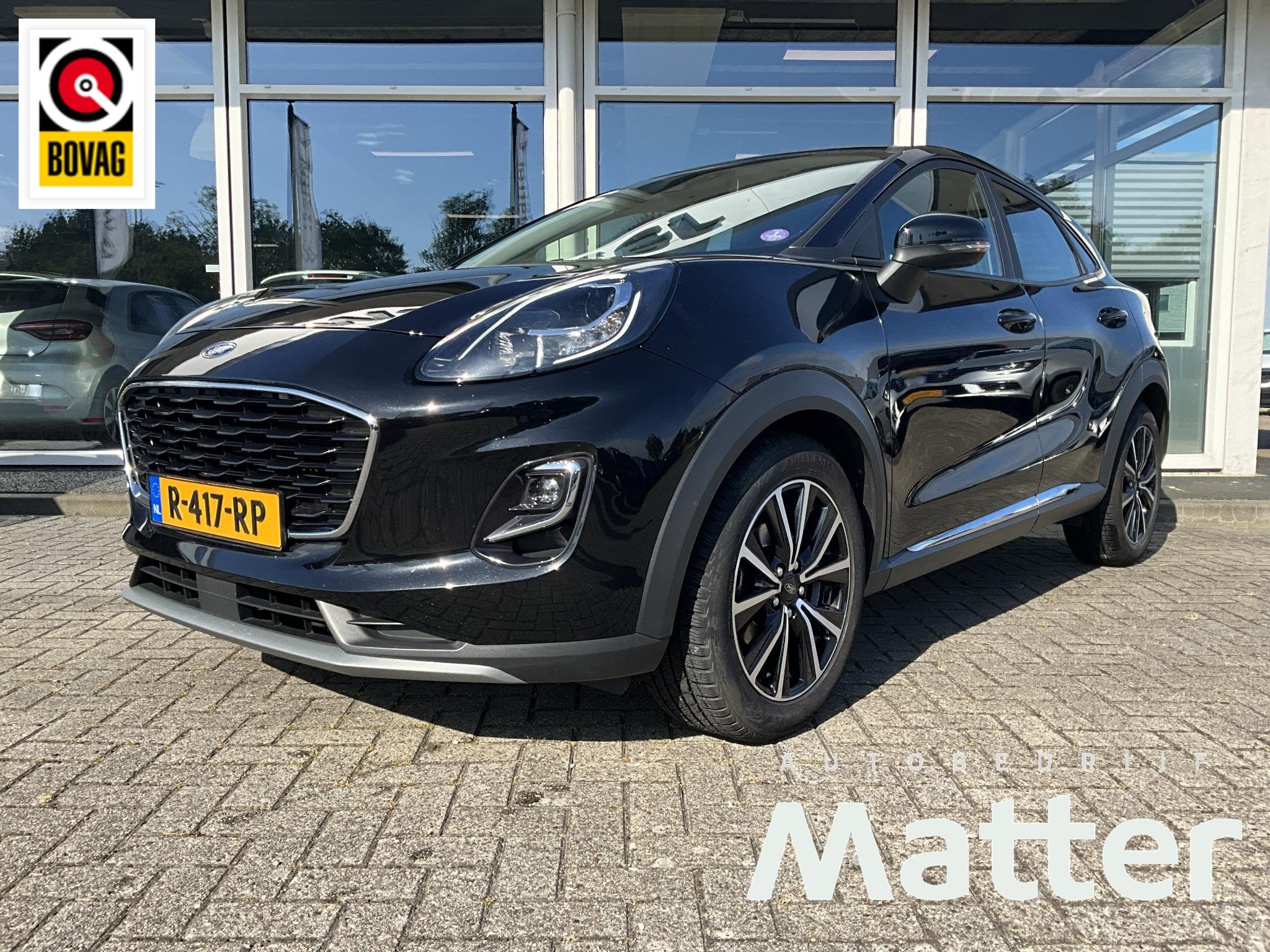 Ford Puma 1.0 EcoBoost Hybrid Titanium, Auto's, Voorwielaandrijving, Met garantie (alle), Zwart, Bedrijf