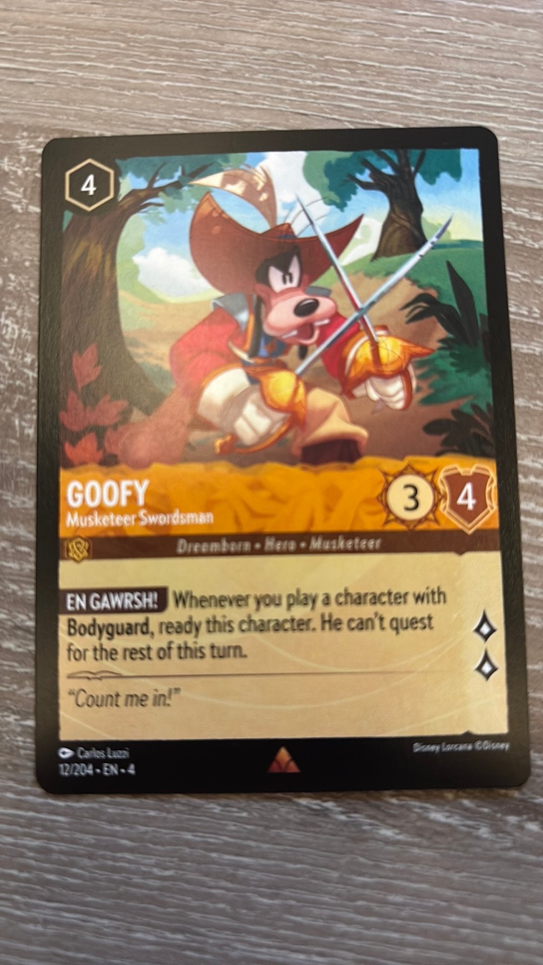 Disney Lorcana Goofy Musketeer swordsman 12-204 4URS nonfoil, Ophalen of Verzenden, Zo goed als nieuw