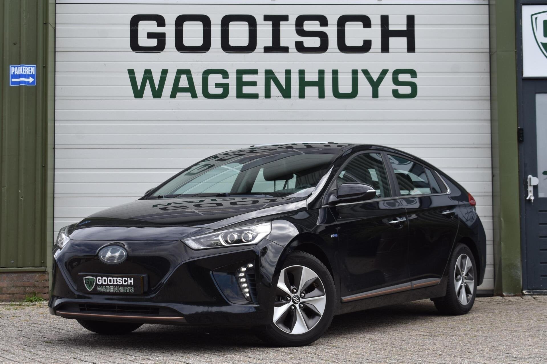 Hyundai IONIQ Premium EV | 100% SoH | Schuifdak | Leder | Me, Auto's, Met garantie (alle), Zwart, IONIQ, Autotrust