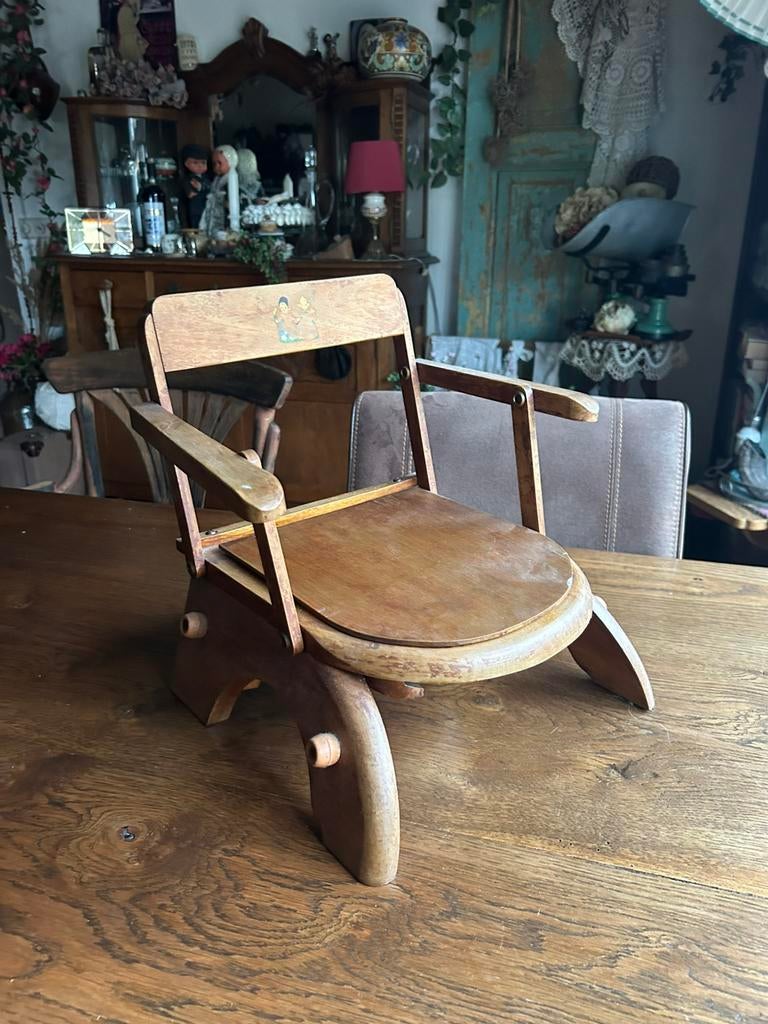 Lage kinderstoel met potje, Ophalen