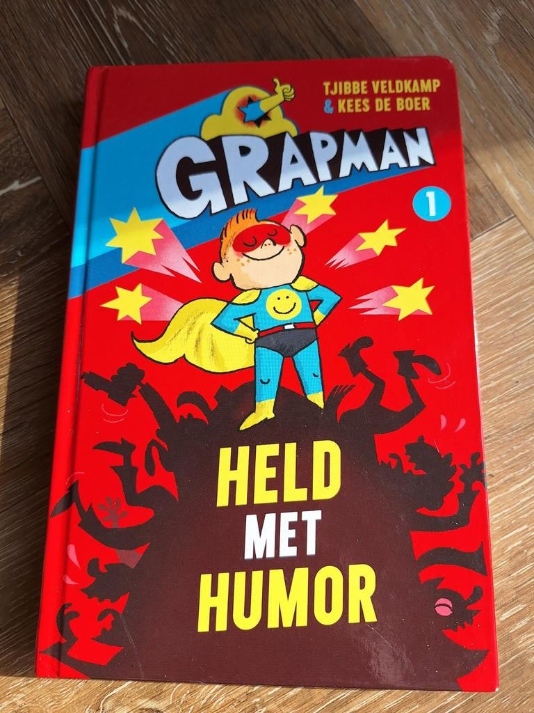 Grapman 1: Held met Humor - Tjibbe Veldkamp & Kees de Boer, Boeken, Ophalen of Verzenden, Zo goed als nieuw, Tjibbe Veldkamp & Kees de Boer