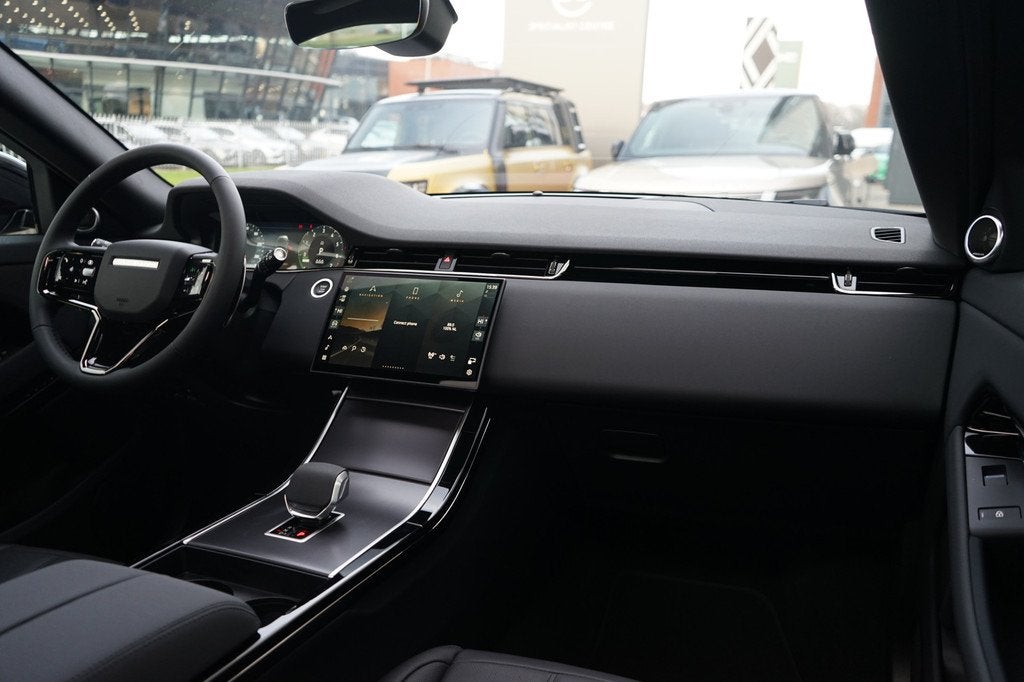 Land Rover Range Rover Evoque P270e PHEV AWD Business Dynami, Auto's, Land Rover, 12 maanden, 1498 cc, Zwart, Leder