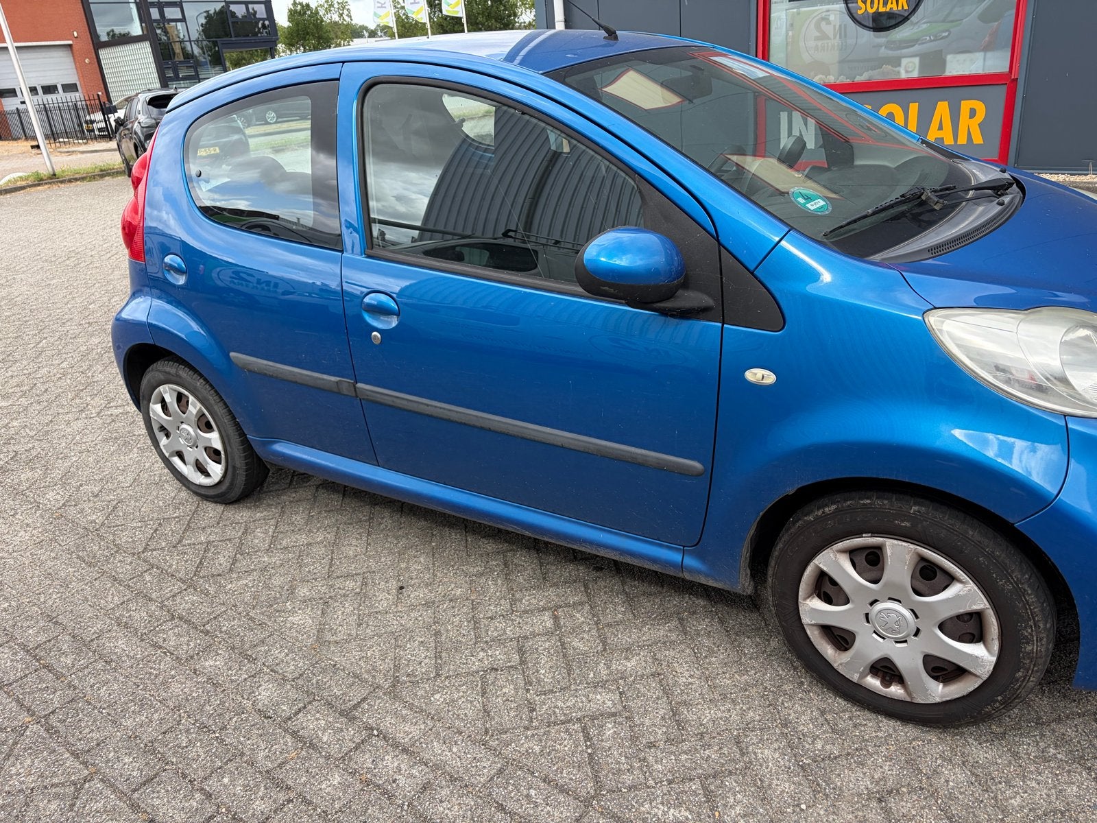 Peugeot 107 1.0 12V 5DR 2009 Blauw, Auto's, Voorwielaandrijving, 68 pk, Origineel Nederlands, Handgeschakeld