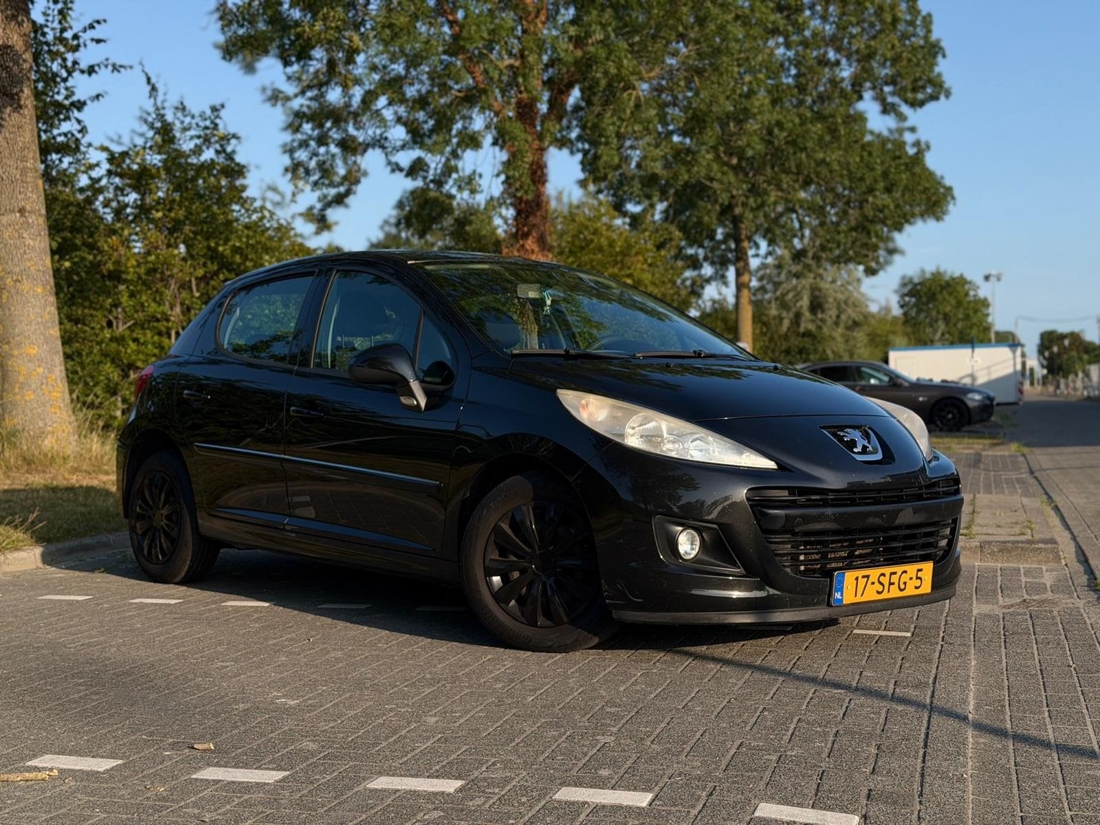 Peugeot 207 1.4 VTI 16V 5DRS 2011 Zwart, Auto's, Voorwielaandrijving, Stof, Zwart, 1064 kg