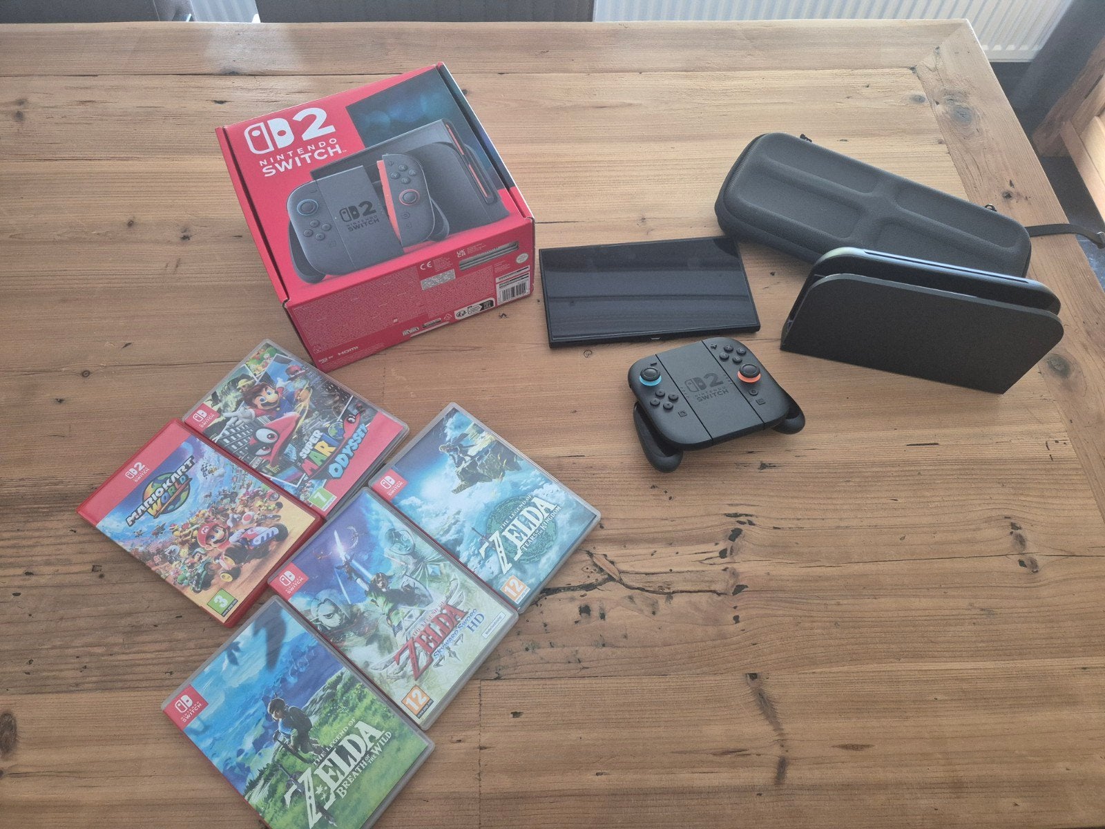 Nintendo Switch 2 + 5 games + reiskoffer - complete set, Spelcomputers en Games, Ophalen, Met games, Zo goed als nieuw, Switch Original