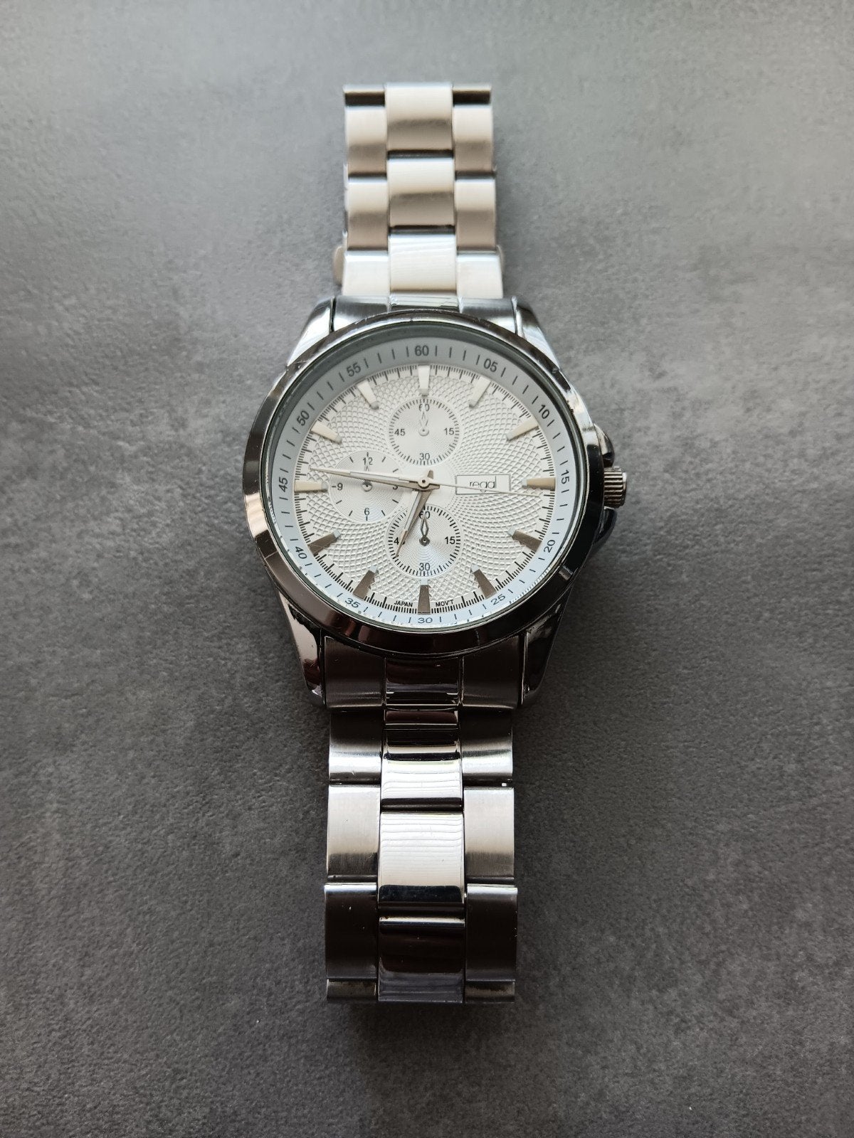 Regal Herenhorloge R1195 - Zilverkleurig Staal, Sieraden, Tassen en Uiterlijk, Horloges | Heren, Ophalen of Verzenden, Gebruikt