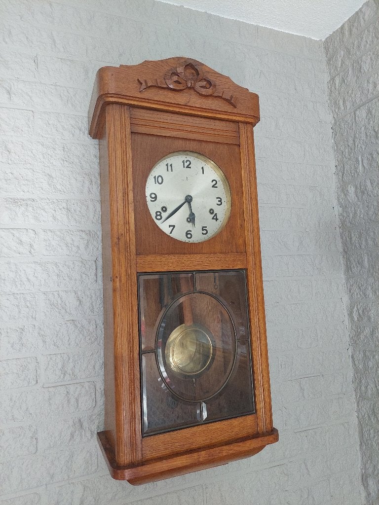 Antieke wand klok, Ophalen