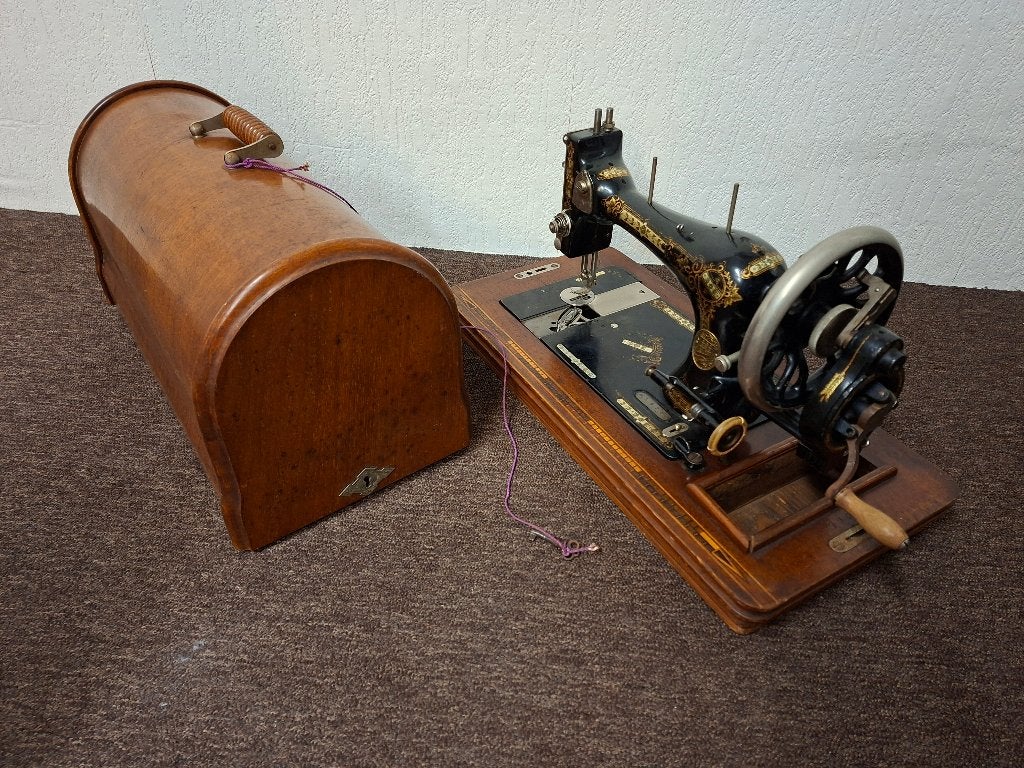 Antieke Singer naaimachine, Ophalen