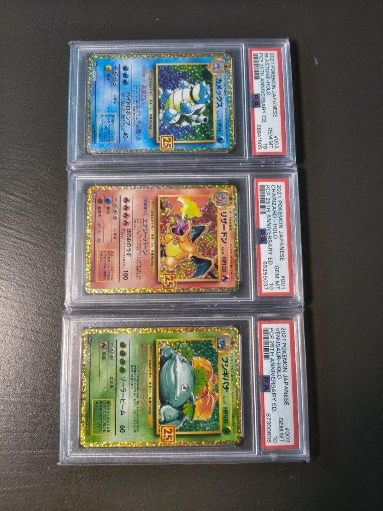 2021 Japanse Charizard Holo PSA 10 25th Anniversary, Ophalen of Verzenden, Zo goed als nieuw, Meerdere kaarten