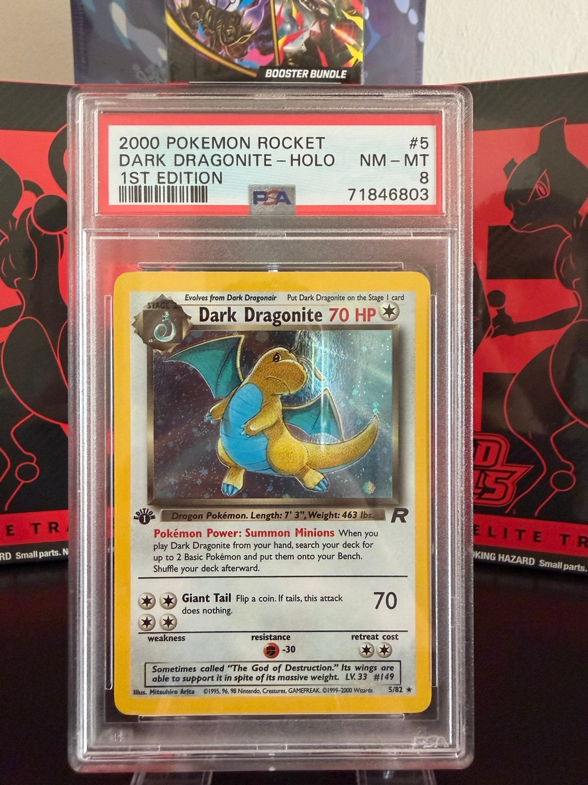 PSA 8 Dark Dragonite Holo 1st Edition Rocket Pokémon Kaart, Ophalen of Verzenden, Zo goed als nieuw, Losse kaart, Foil