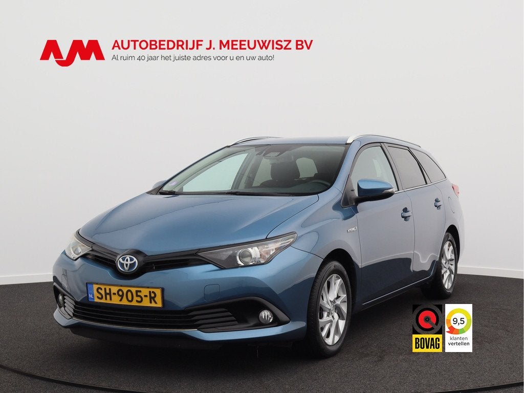 Toyota Auris 1.8 Hybrid Dynamic/ lage km/ zeer mooi!, 28 km/l, Gebruikt, Blauw, Hybride Elektrisch/Benzine