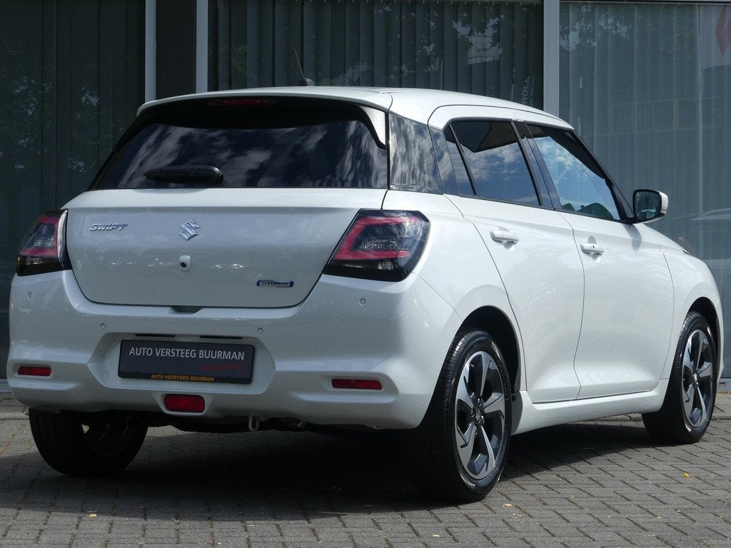 Suzuki Swift 1.2 Style Smart Hybrid AUTOMAAT Uit Voorraad le, Auto's, Suzuki, 12 maanden, Stof, Euro 6, Bedrijf