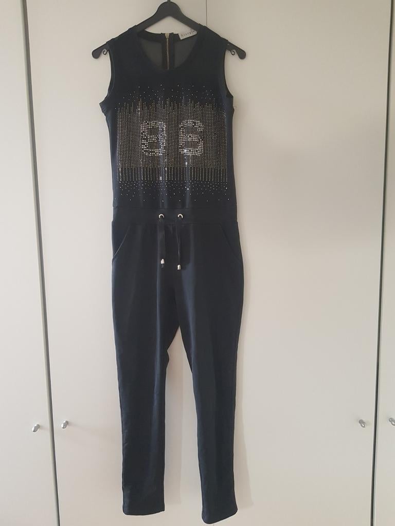 Zwarte jumpsuit met zilveren glitters - large ***zgan***, Ophalen of Verzenden, Zo goed als nieuw, Maat 42/44 (L), Zwart