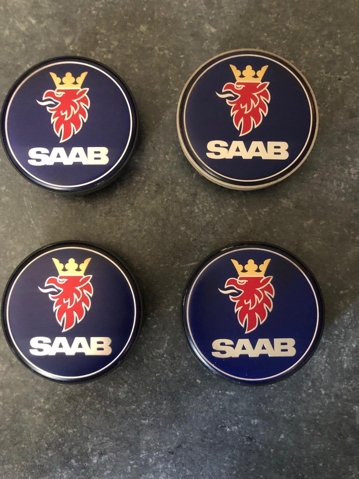 Set van 4 blauwe Saab naaf wieldoppen, Ophalen of Verzenden, Gebruikt, Saab