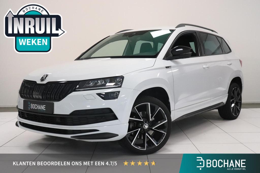 Skoda Karoq 1.5 TSI ACT Sportline Business | Camera | Adapti, Stof, 4 cilinders, Wit, Bedrijf