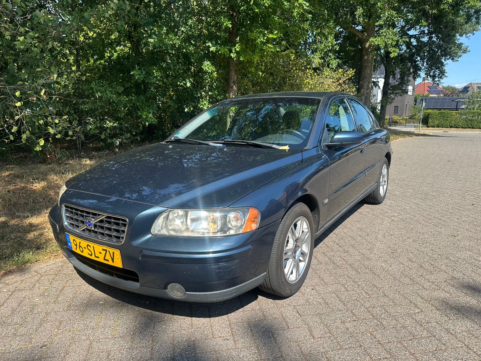 Volvo S60 2.4 140PK AUT 2006 Blauw, Auto's, Zwart, Blauw, 2435 cc, 1600 kg