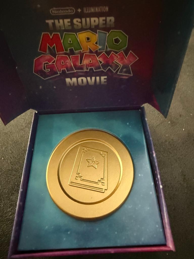 Mario galaxy movie book coin nieuw!, Ophalen, Nieuw