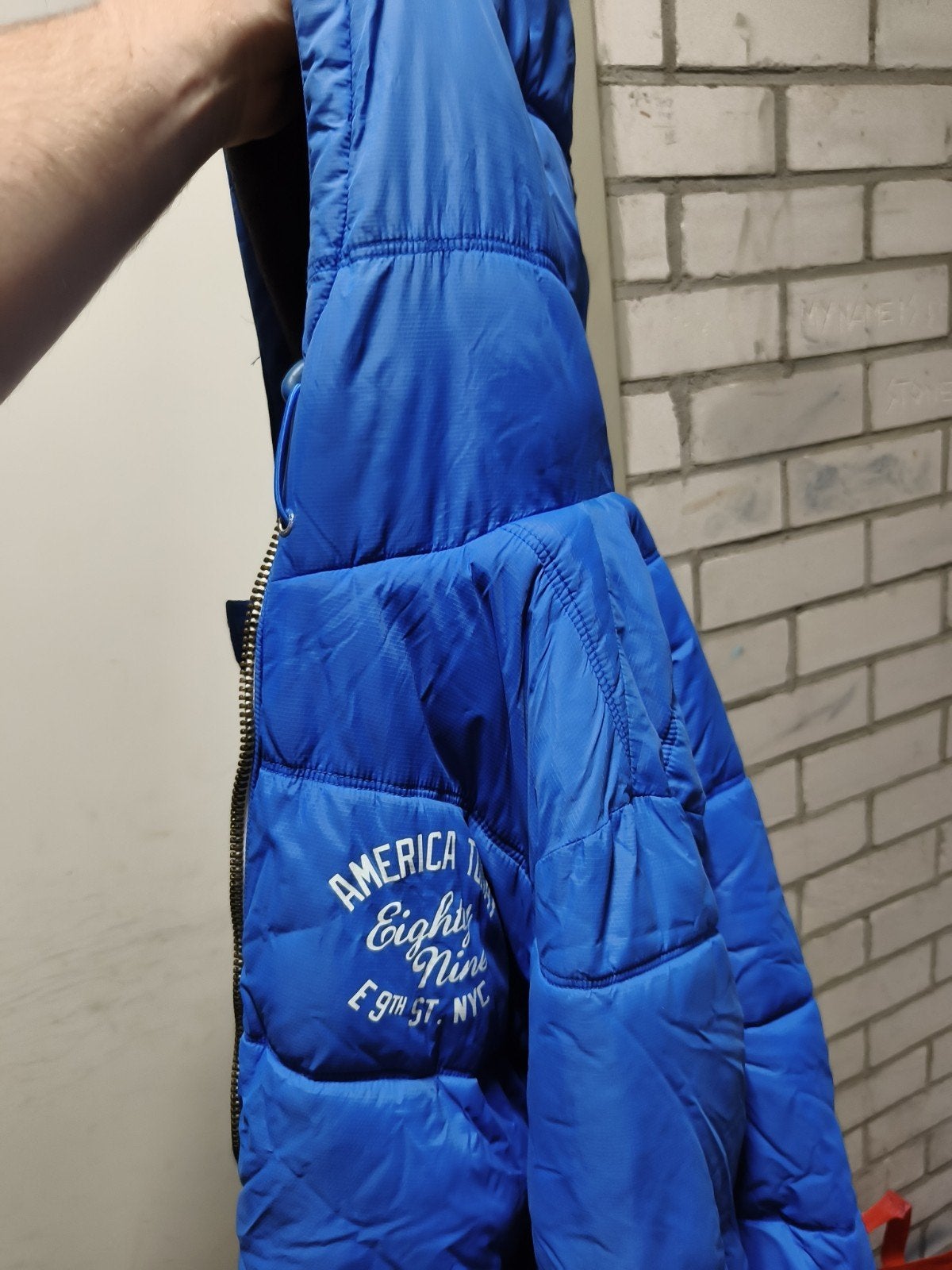 Blauwe gewatteerde jas met capuchon - Maat M, Kleding | Dames, Maat 38/40 (M), Blauw, America, Ophalen of Verzenden