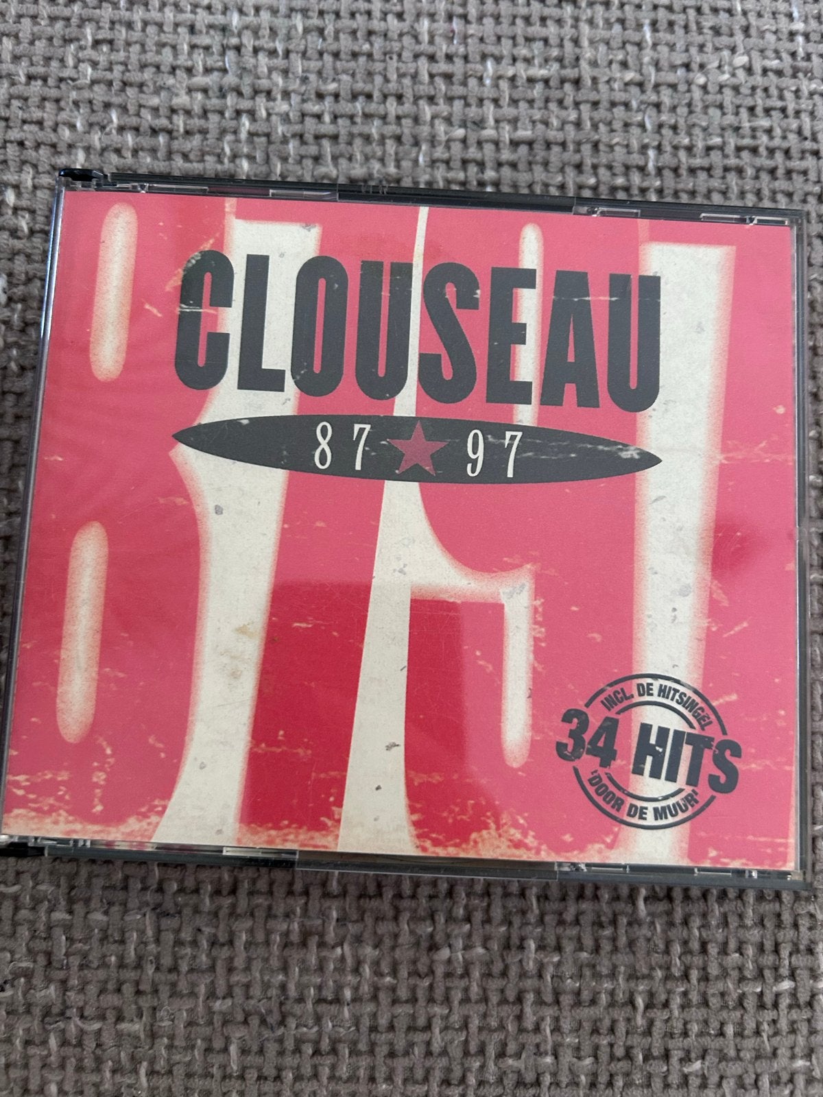 Clouseau 87-97 CD - 34 Hits inclusief 'Door De Muur', Ophalen of Verzenden, Zo goed als nieuw, Inclusief boekje, Verzamelalbum