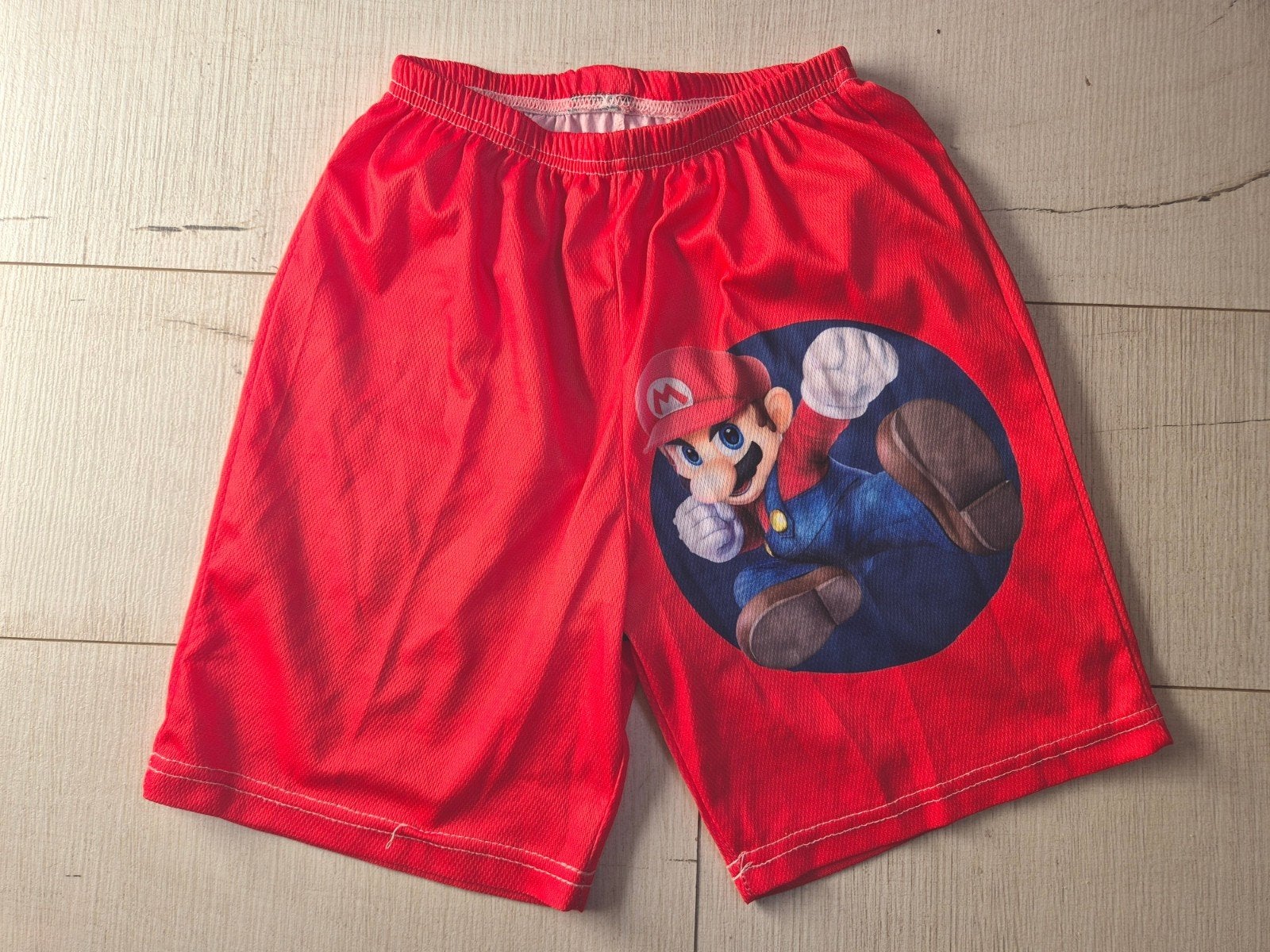 Rode Super Mario short mt 140, als NIEUW, Ophalen, Jongen, Broek