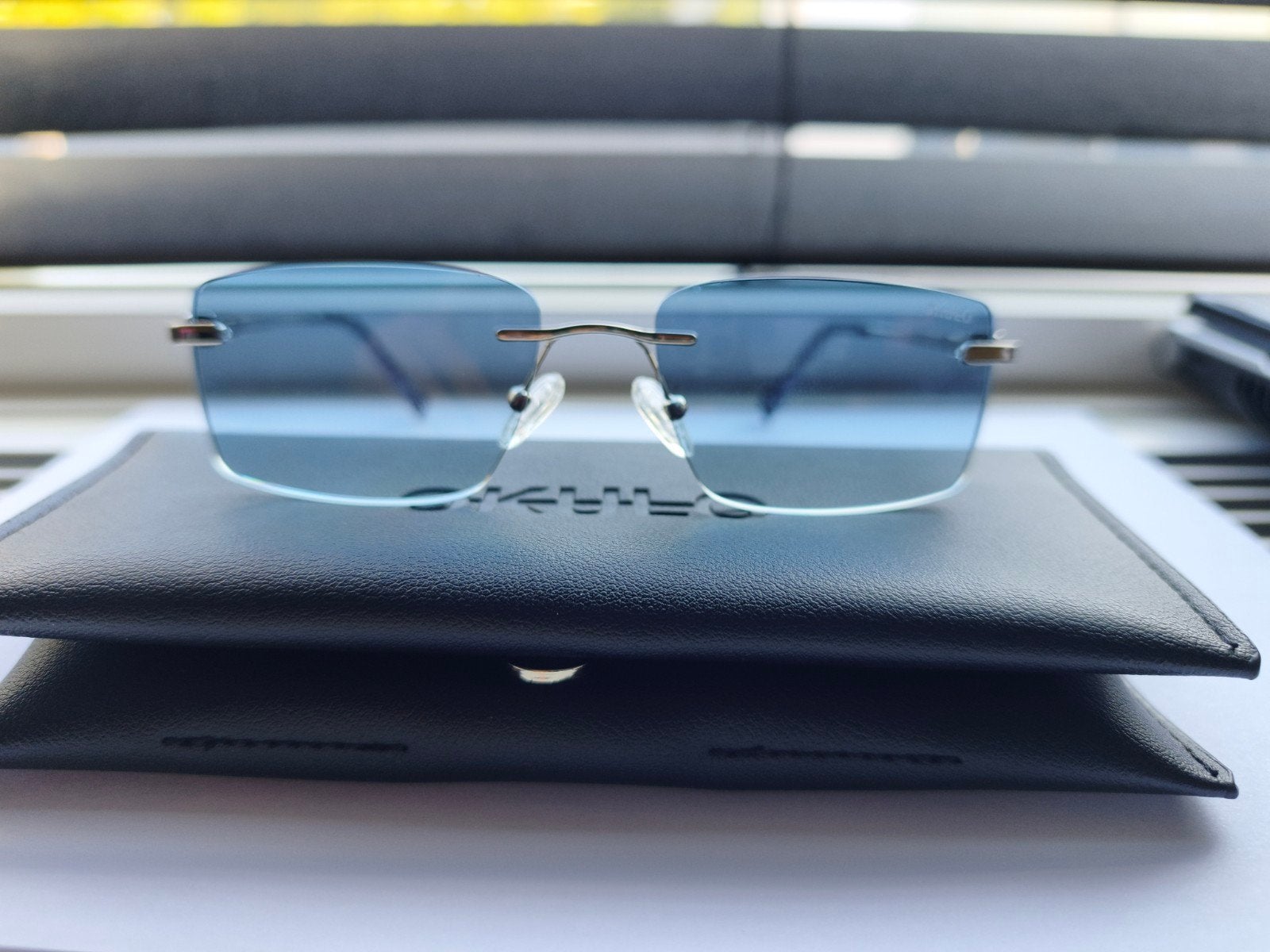 Stijlvolle Okulo Eyewear Milano Zonnebril Randloos Paars, Overige merken, Zonnebril, Paars, Ophalen of Verzenden