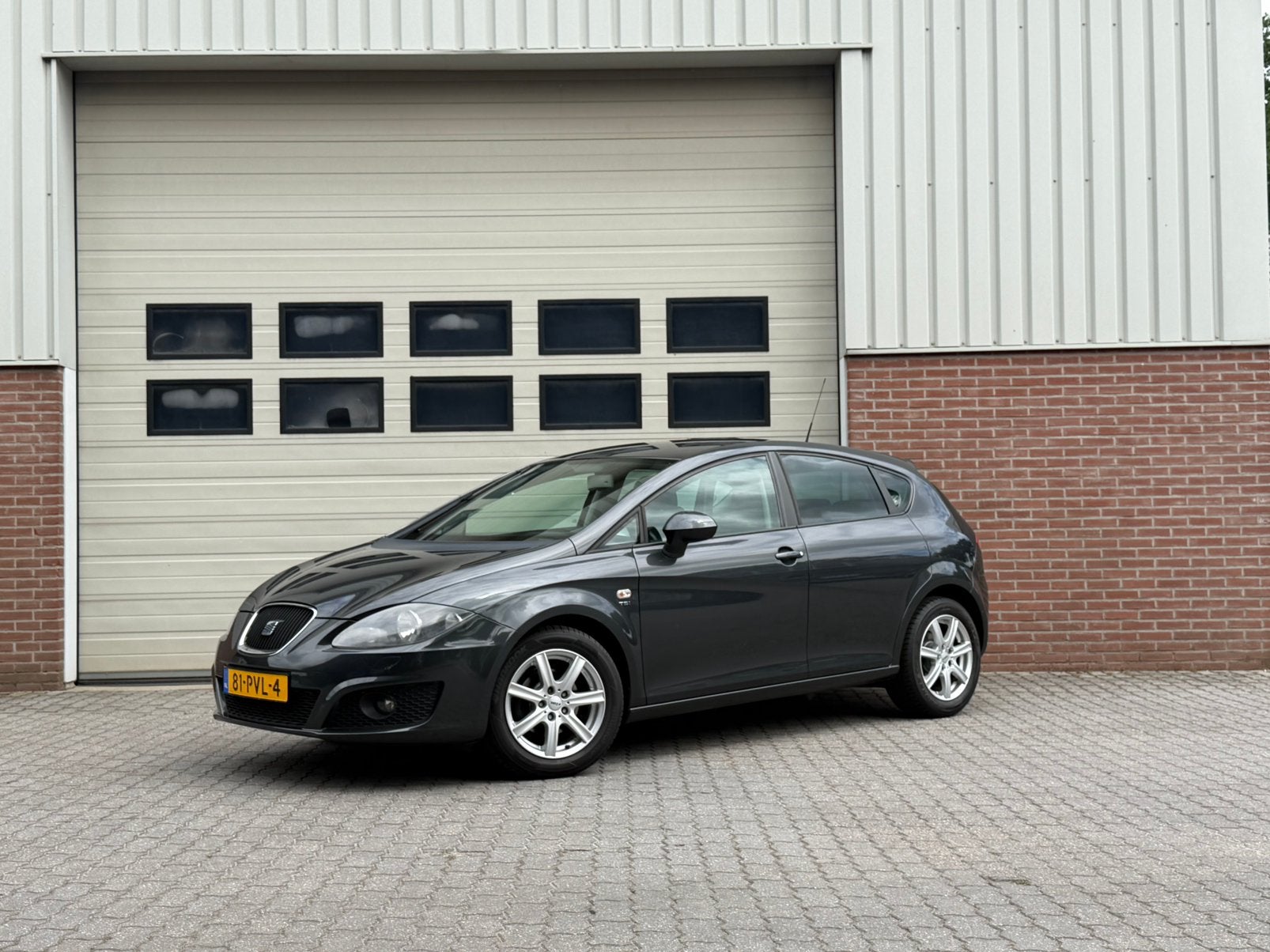 Seat Leon 1.2 TSI PDC|Navi|Bluetooth|Cruise|Stoelverwarming, Auto's, Voorwielaandrijving, Euro 5, Zwart, 4 cilinders