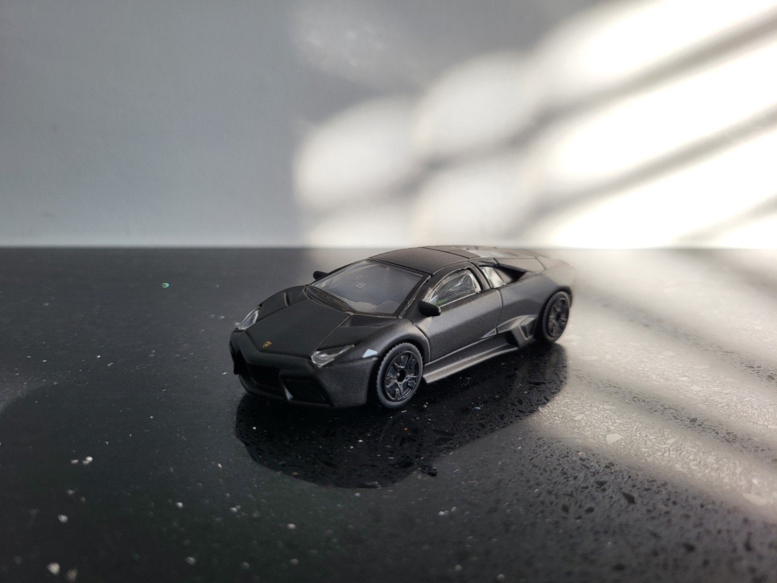 Lamborghini Reventon grijs 1/43 Bburago, Ophalen of Verzenden, Zo goed als nieuw, Auto, Overige merken