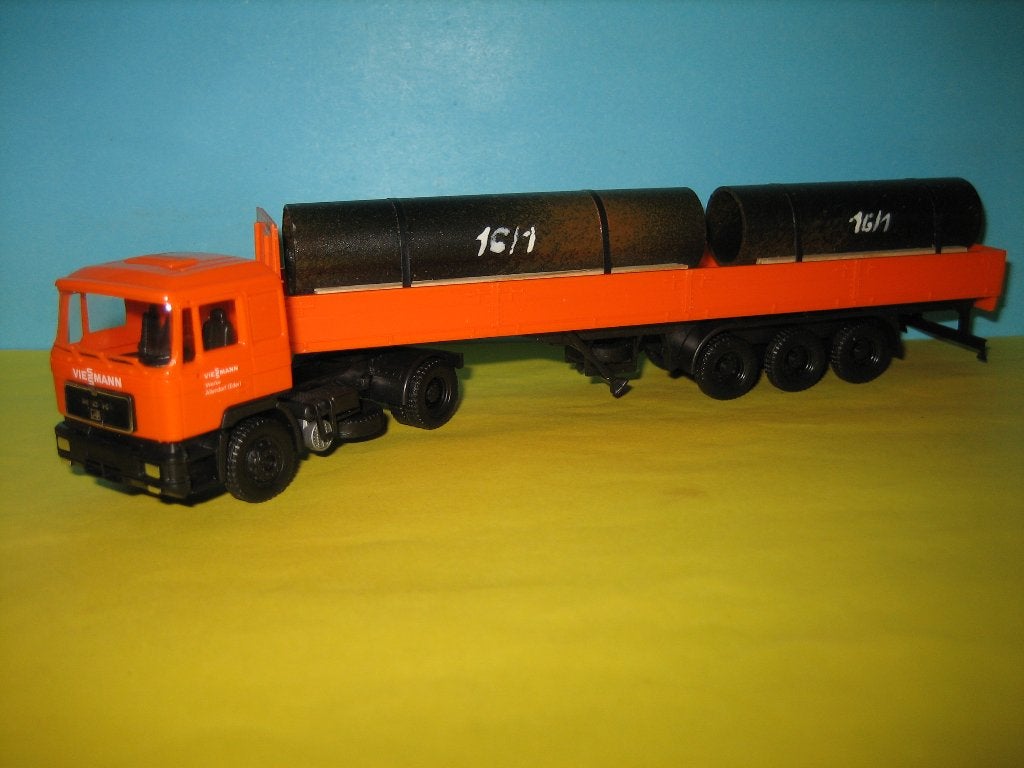 LA-04 MAN met oplegger  compl. met lading buizen  Herpa, Ophalen of Verzenden, Zo goed als nieuw, Bus of Vrachtwagen, Herpa