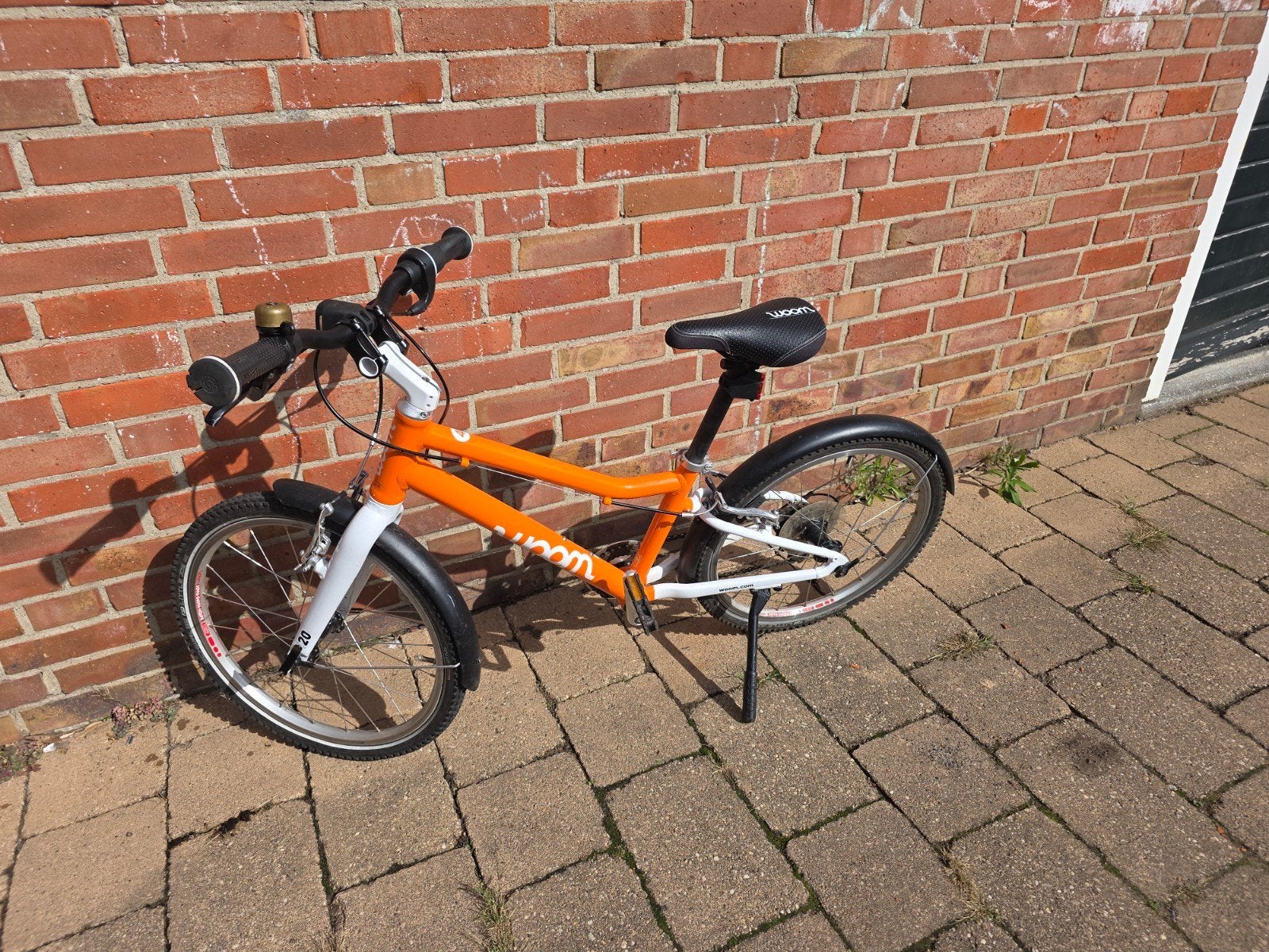Woom 4 kinderfiets - 20 inch - Oranje, Ophalen, 20 inch of meer, Velgrem, Zo goed als nieuw