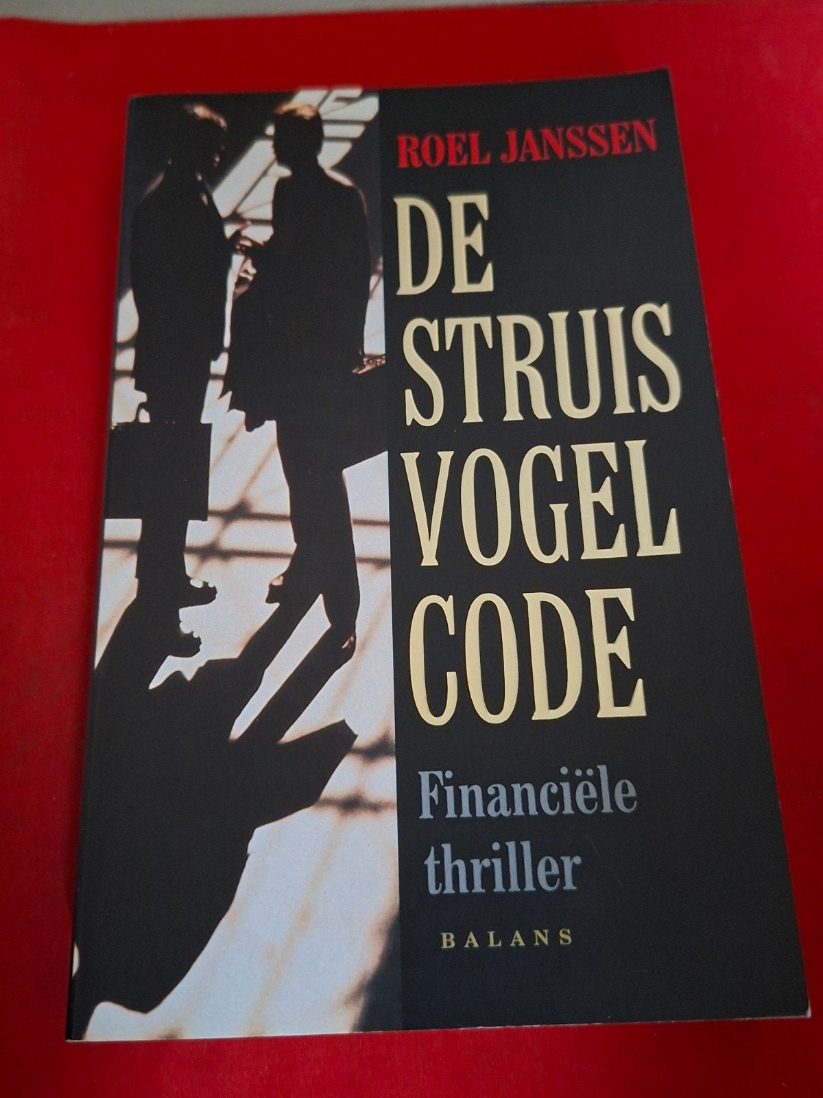 GESIGNEERD De struisvogel-code. Roel Janssen, Ophalen of Verzenden, Zo goed als nieuw